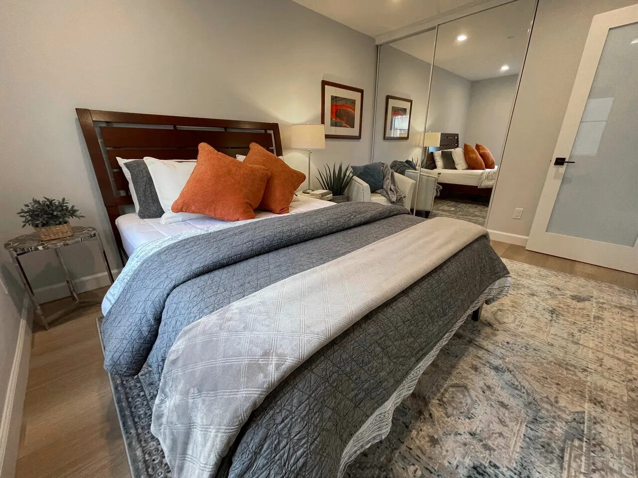 Bedroom with Casper mattress, blackout shades, and mirrored closet