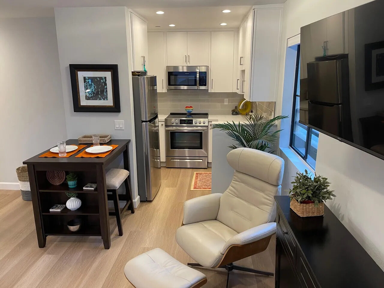 Fully furnished kitchen and dining area in the Live Work Play Hillcrest apartment